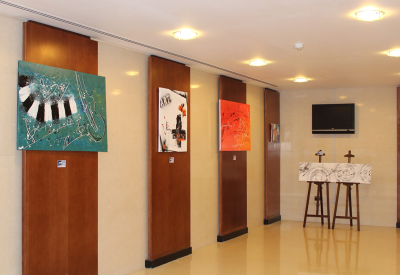 Art exhibit is being displayed in the hotel's lobby.